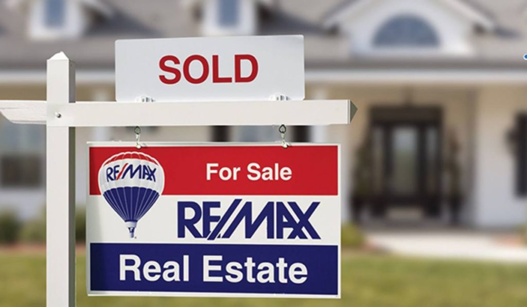 signage for a house sold at RE/MAX